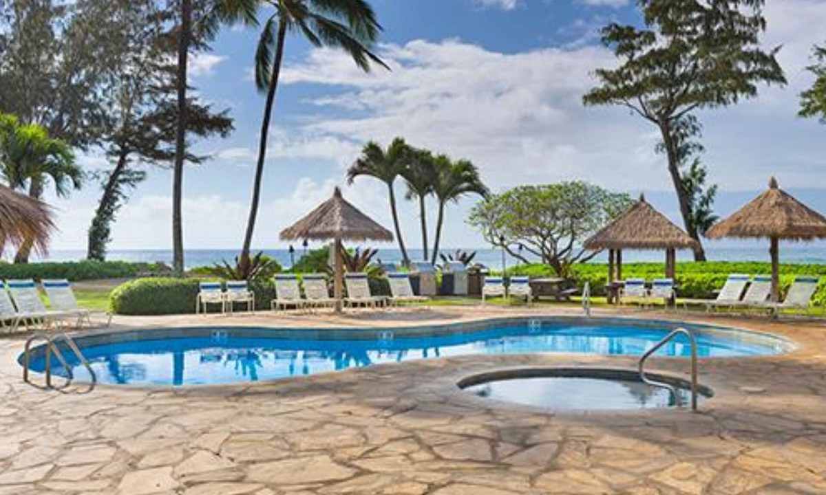 Wailua Resort | Beachfront is set amid palm trees on 6 acres of beautifully landscaped gardens!