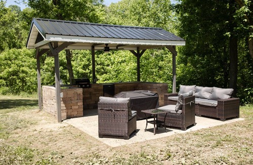 Sharpsburg House | 9511 Compressor Rd, Chesterhill, OH - Outdoor Movie Theater with Outdoor Kitchen and Games
