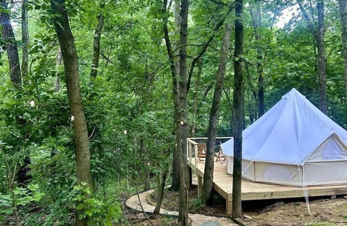 Gentry RV Rental | Charming Woodland Glamping Tents with Fire Pit and Elevated Decks near Gentry, West Virginia