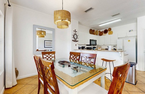 Frangista Beach Condo | Comfortable ground floor condo with pool & hot tub access, W&D, WiFi, and AC