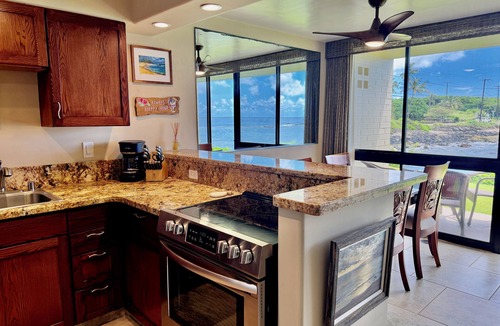 Poipu Condo | Fully Renovated Oceanfront with Air Cond. Ground Floor Unit with Spacious Lanai!
