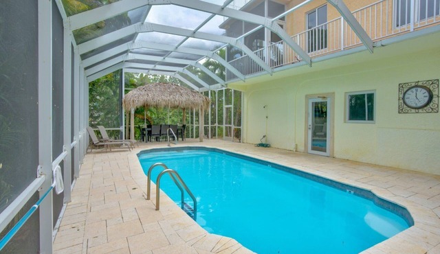 Big Kahuna – an expansive and inviting 5-bedroom, 4-bathroom single-family haven that encapsulates the essence of Florida Keys living in Marathon