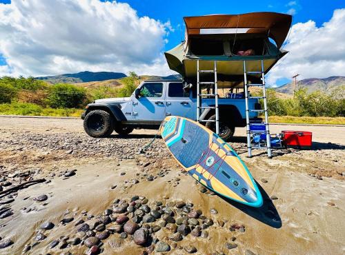 Embark on a journey through Maui with Aloha Glamp's jeep and rooftop tent allows you to discover diverse campgrounds, unveiling the island's beauty from unique perspectives each day in Paia