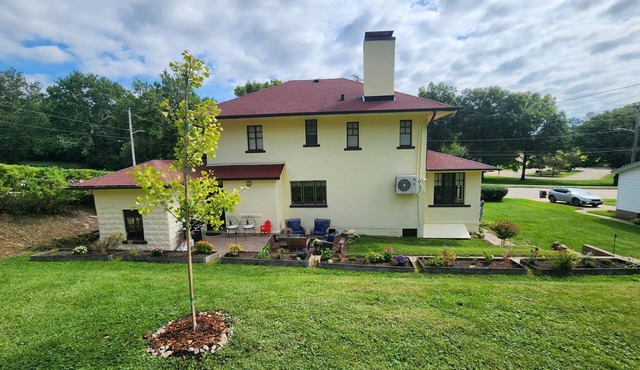 Spanish Revival 1920 Home in Quiet Neighborhood with Sunroom and Outdoor Patio in Dubuque
