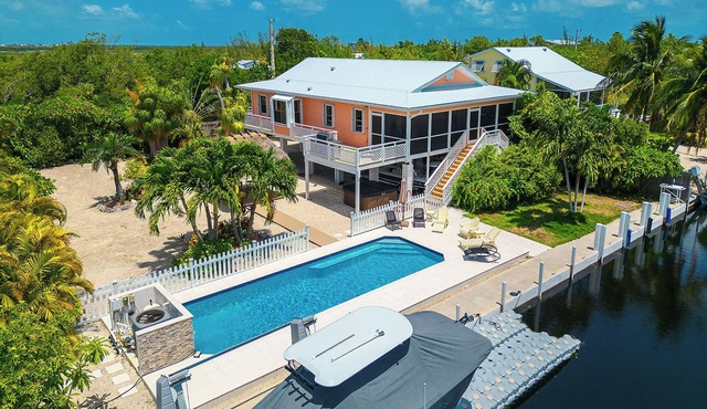 Tropical Oasis with Beautiful Home, Pool, Dock and Tiki Hut in Big Pine Key